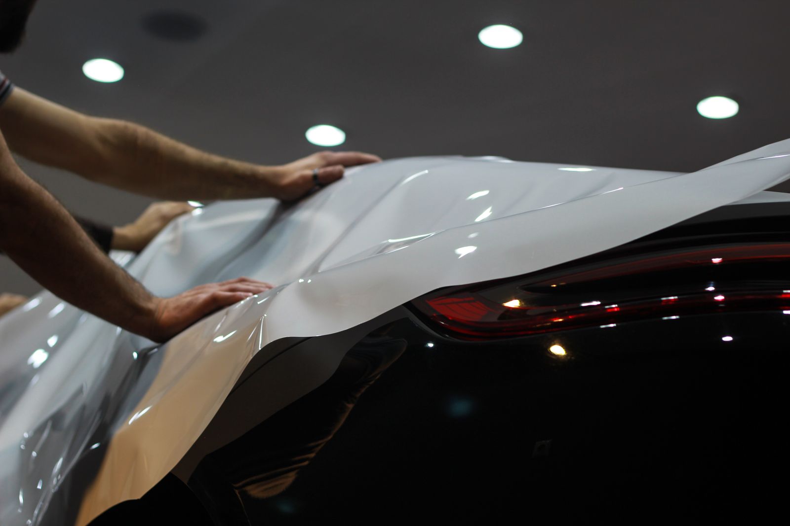 Installer applying a professional vehicle wrap